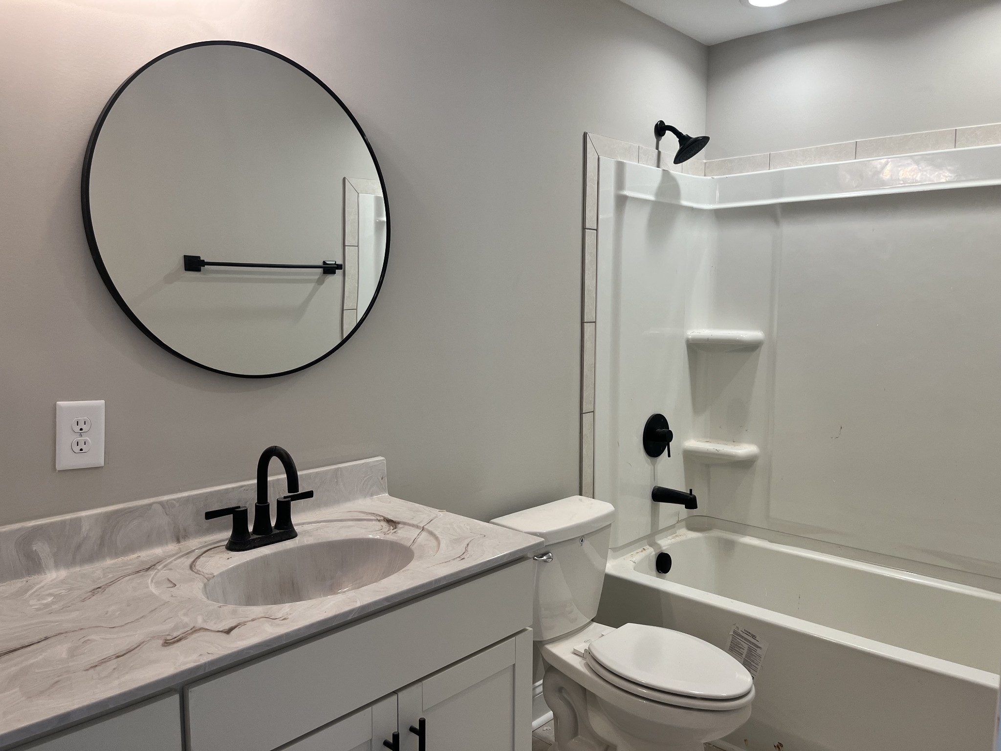 48 Cave Springs Road, Unit LOT 4 Clarksville, TN 37042 - Photo 10 of 12 a bathroom with a sink a toilet and a mirror