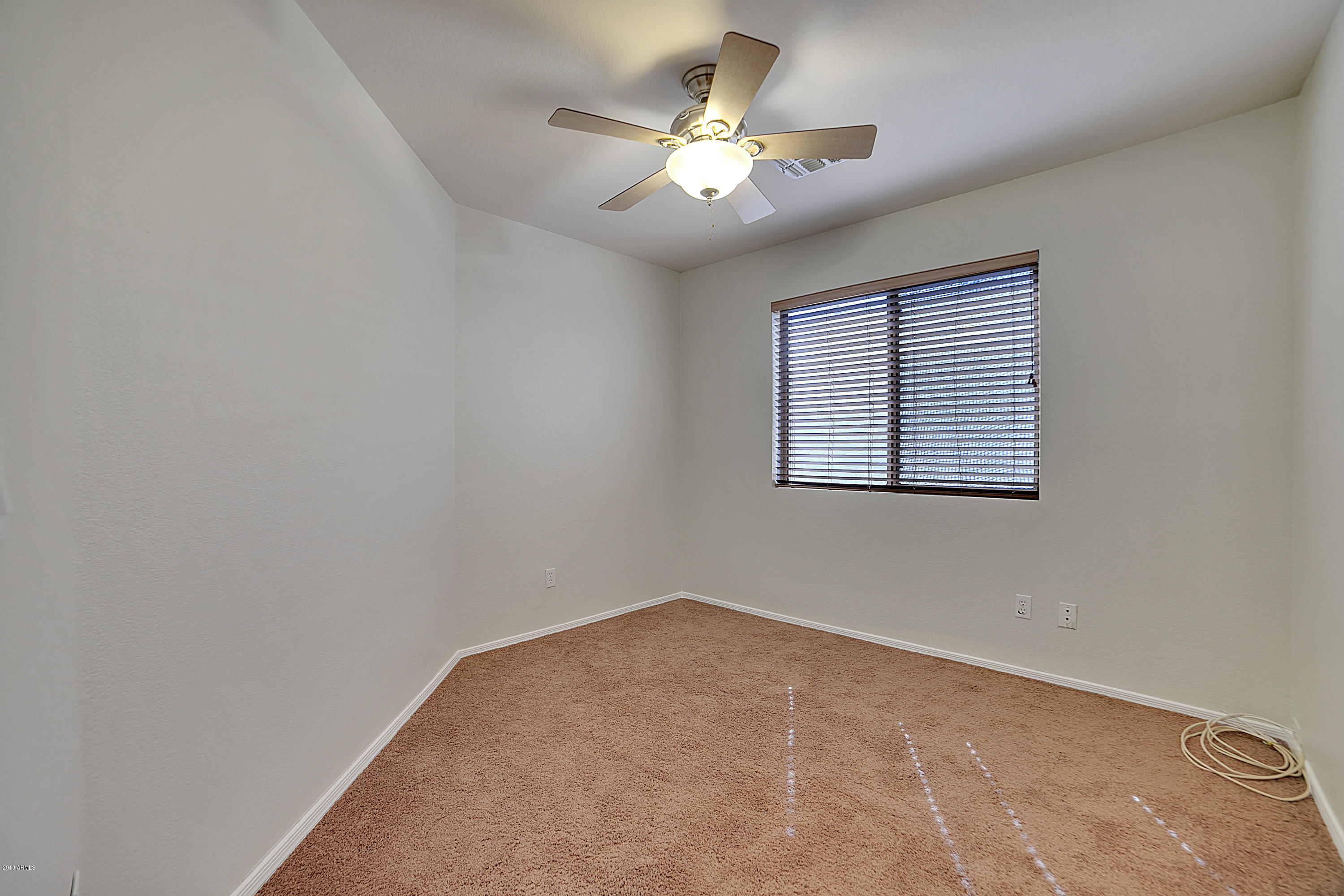 4307 East Rowel Road Phoenix, AZ 85050 - Photo 21 of 27 wooden floor in an empty room with a window