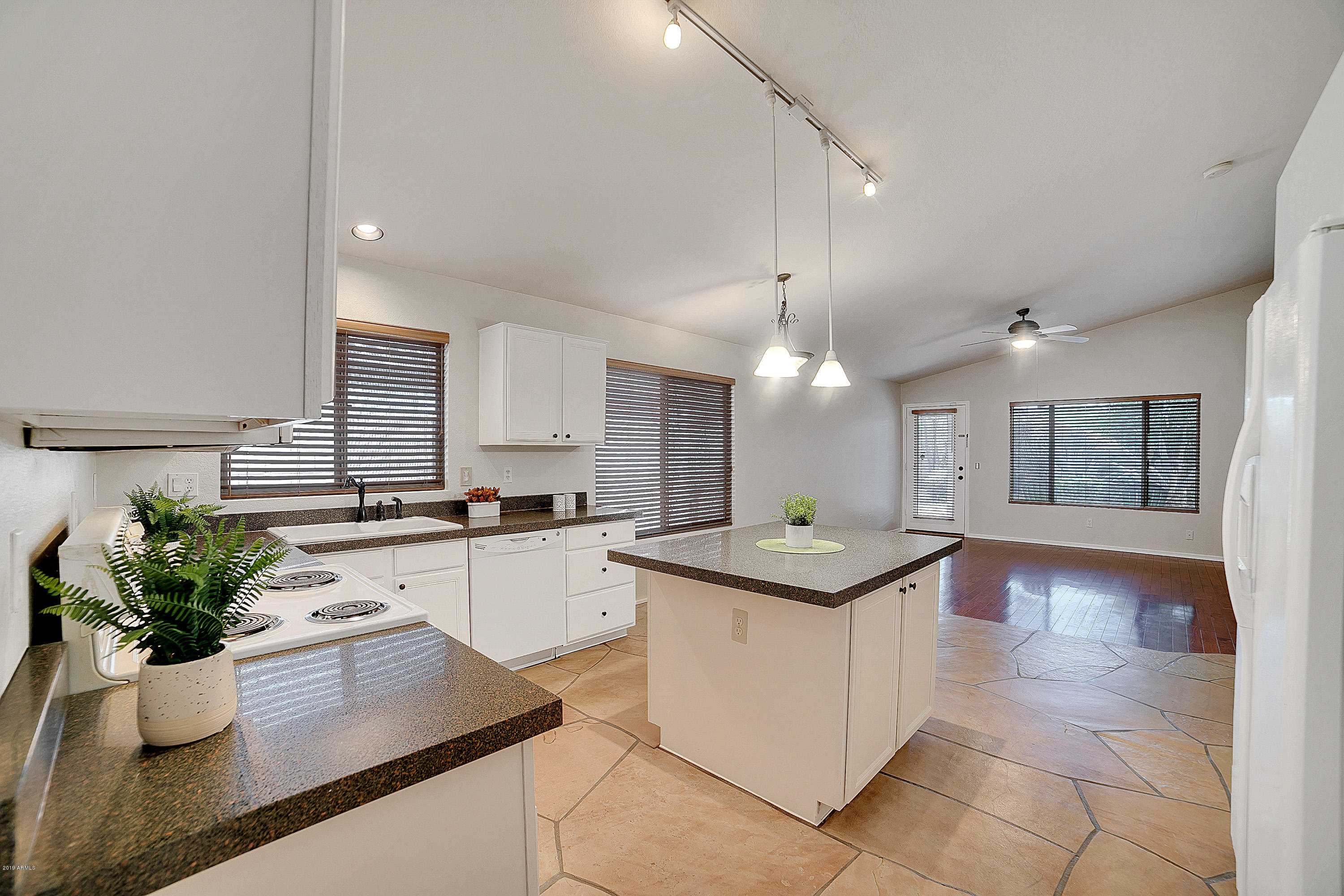4307 East Rowel Road Phoenix, AZ 85050 - Photo 7 of 27 a kitchen with a sink and cabinets