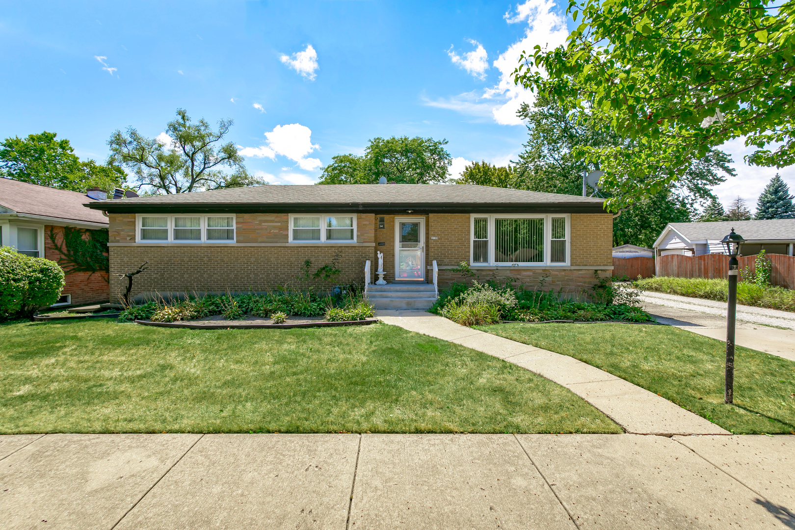 3729 Roth Terrace Skokie, IL 60076 - Photo 2 of 27 front view of house with a yard