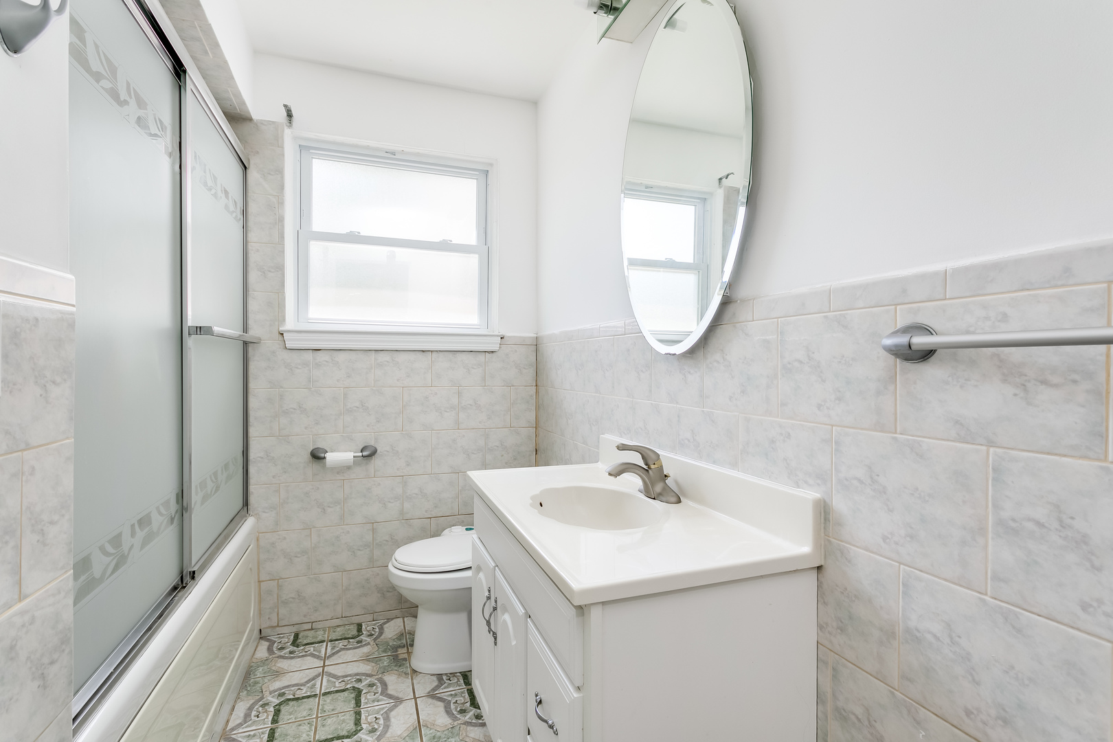 3729 Roth Terrace Skokie, IL 60076 - Photo 13 of 27 a bathroom with a sink a toilet and a mirror