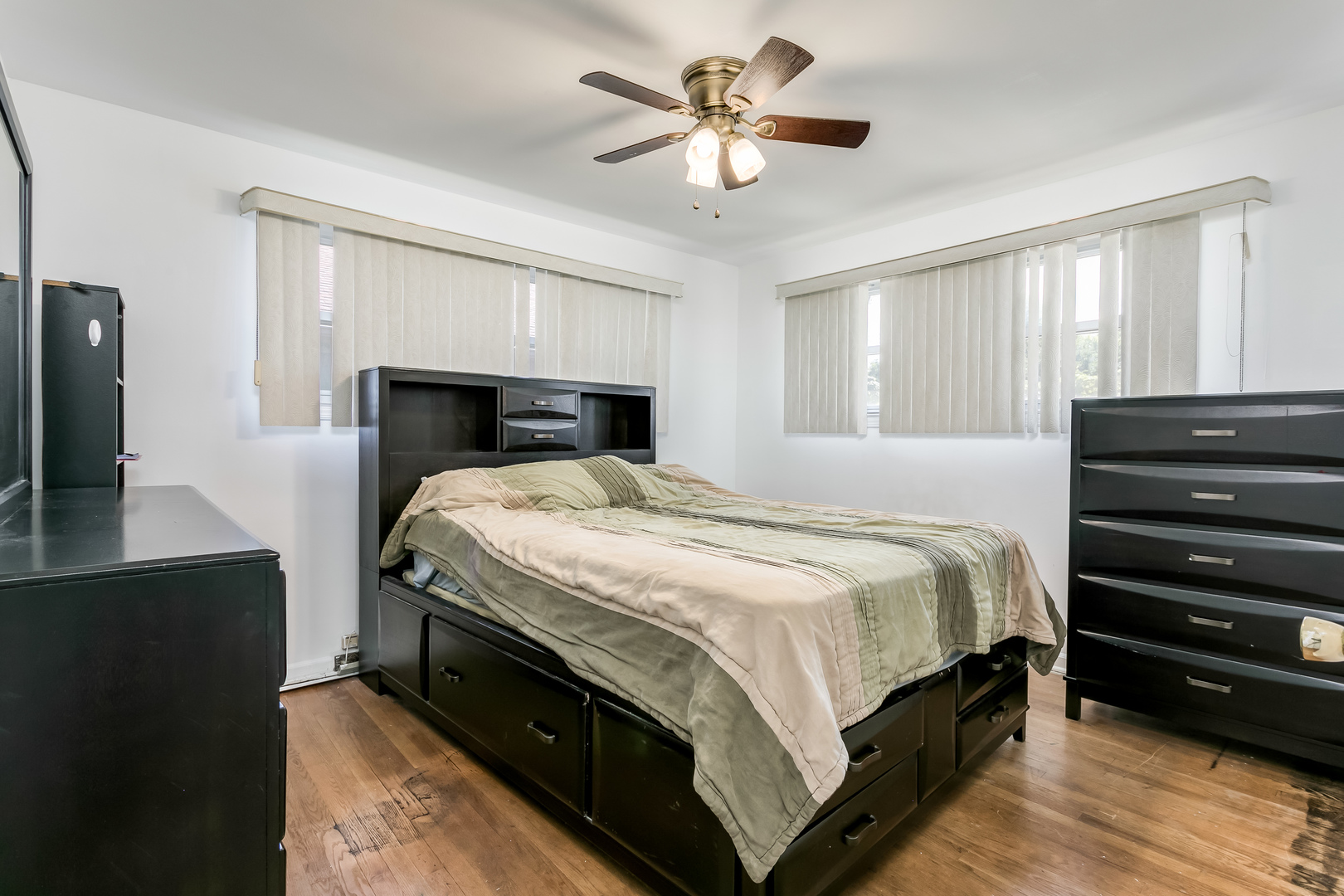 3729 Roth Terrace Skokie, IL 60076 - Photo 15 of 27 a bedroom with a bed dresser and a flat tv screen