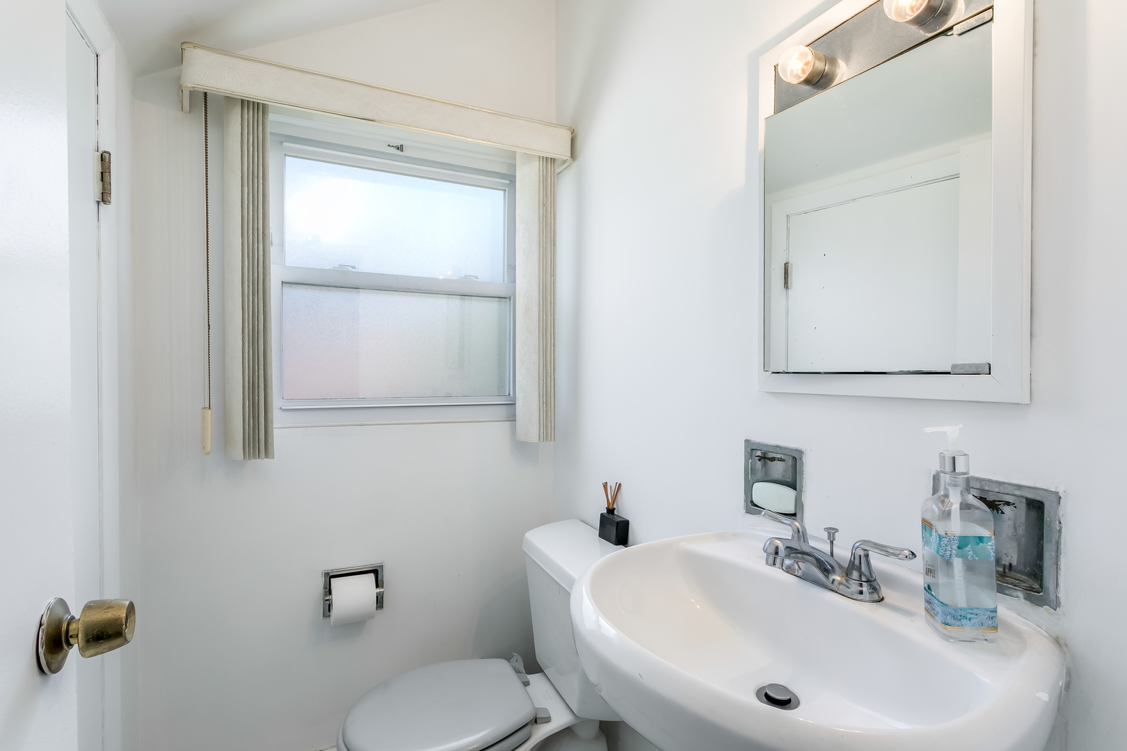 3729 Roth Terrace Skokie, IL 60076 - Photo 17 of 27 a bathroom with a sink mirror and toilet