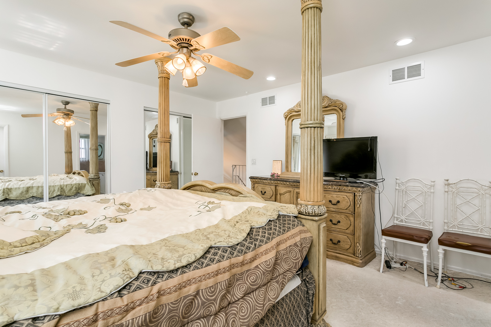 3729 Roth Terrace Skokie, IL 60076 - Photo 18 of 27 a bedroom with a bed and a flat screen tv