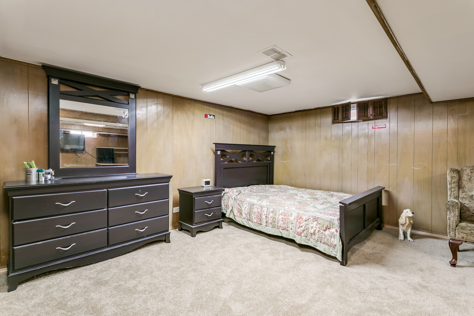 3729 Roth Terrace Skokie, IL 60076 - Photo 19 of 27 a bedroom with a bed and a flat tv screen on dresser