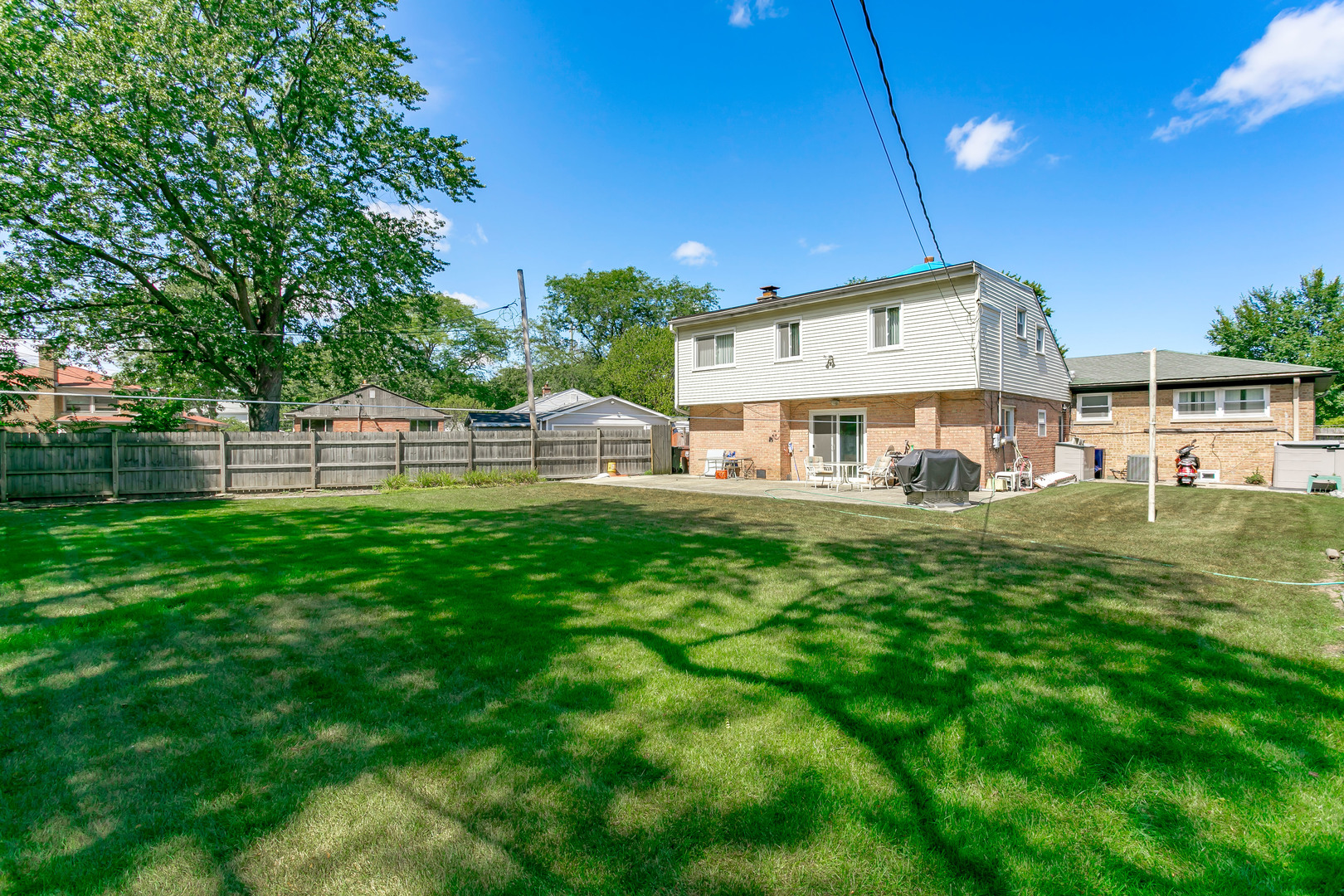 3729 Roth Terrace Skokie, IL 60076 - Photo 23 of 27 a view of a house with a big yard