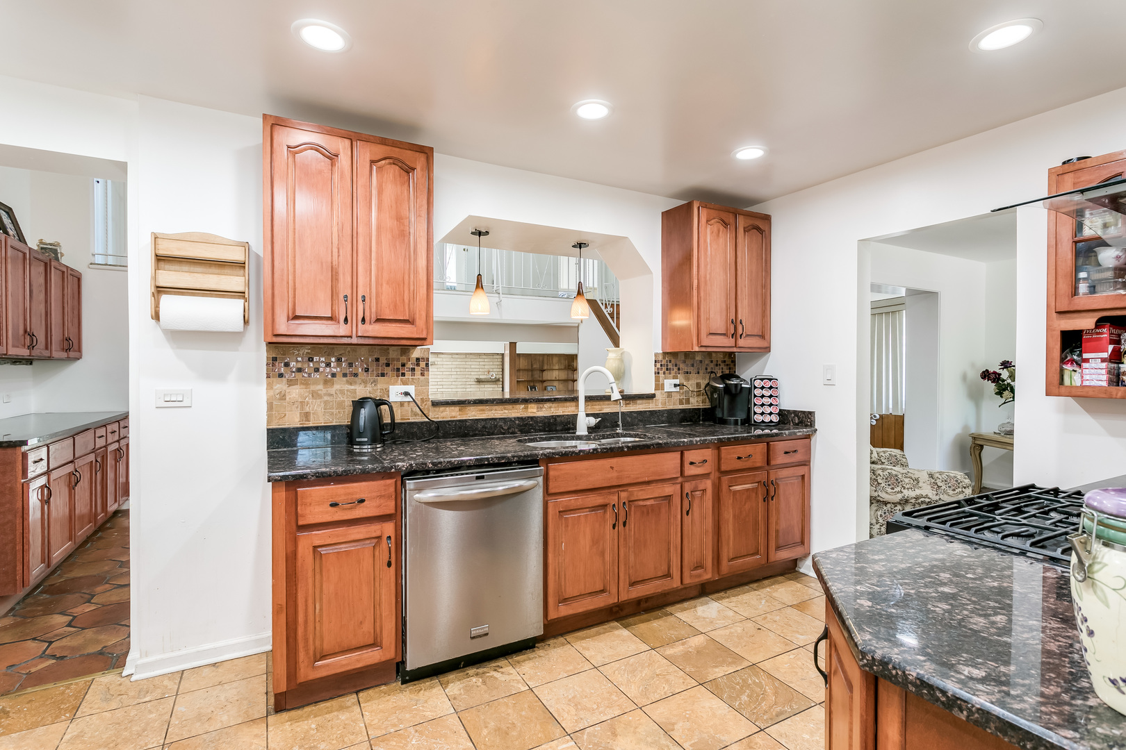 3729 Roth Terrace Skokie, IL 60076 - Photo 8 of 27 a kitchen with stainless steel appliances granite countertop a stove top oven a sink dishwasher and a refrigerator