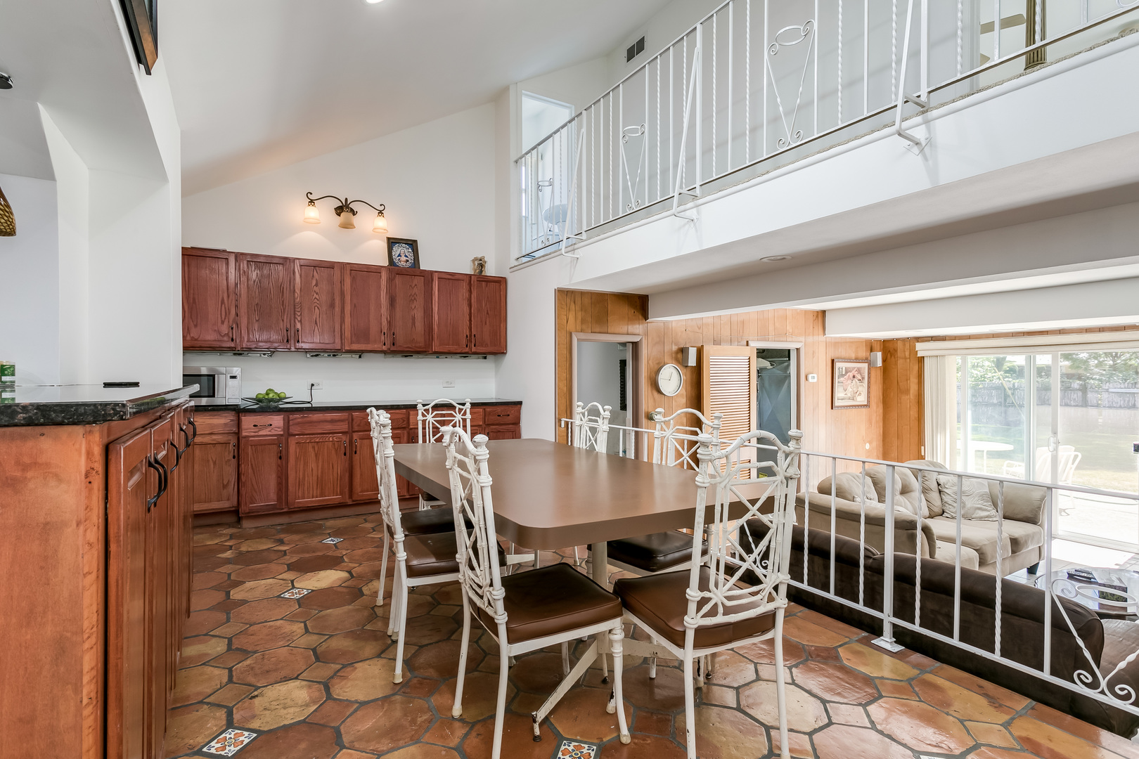 3729 Roth Terrace Skokie, IL 60076 - Photo 9 of 27 a dining table with chairs and chandelier