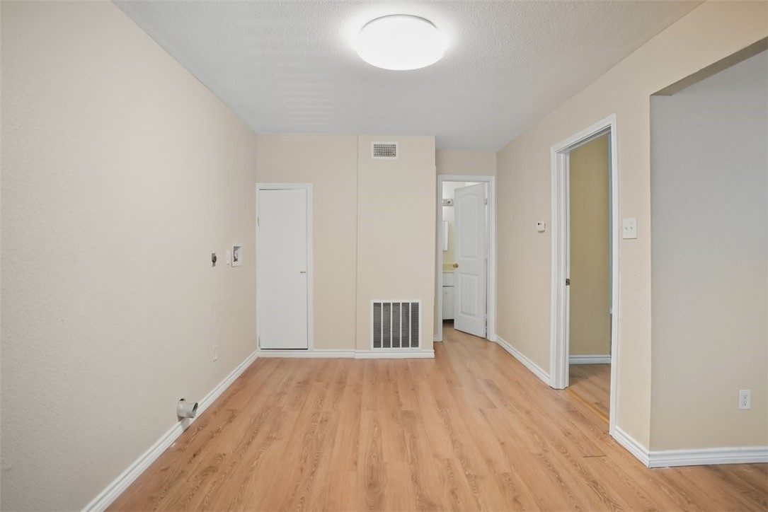 868 Gonzales Street, Unit 2 Robstown, TX 78380 - Photo 15 of 16 wooden floor in an empty room