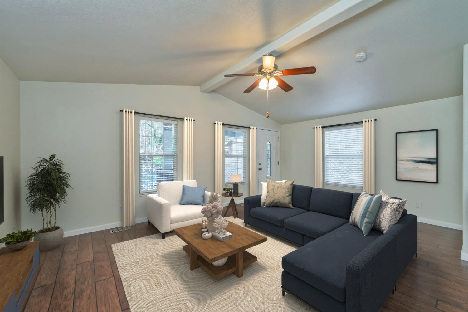 Living Room with Vaulted Ceiling and access to Covered Front Porch *Virtually Staged Image