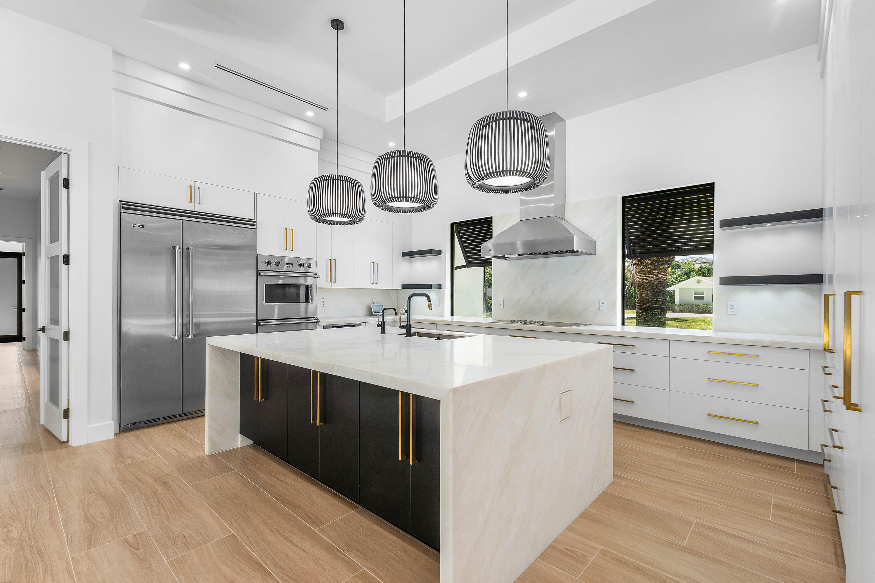 5701 Old Orange Road Jupiter, FL 33458 - Photo 6 of 46 a kitchen with stainless steel appliances a stove a sink and a refrigerator