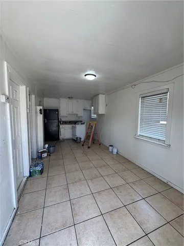 a view of a storage & utility room with a sink