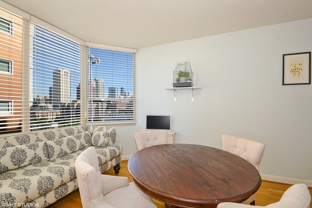 720 West Randolph Street, Unit 808 Chicago, IL 60661 - Photo 3 of 15 a living room with furniture and a window