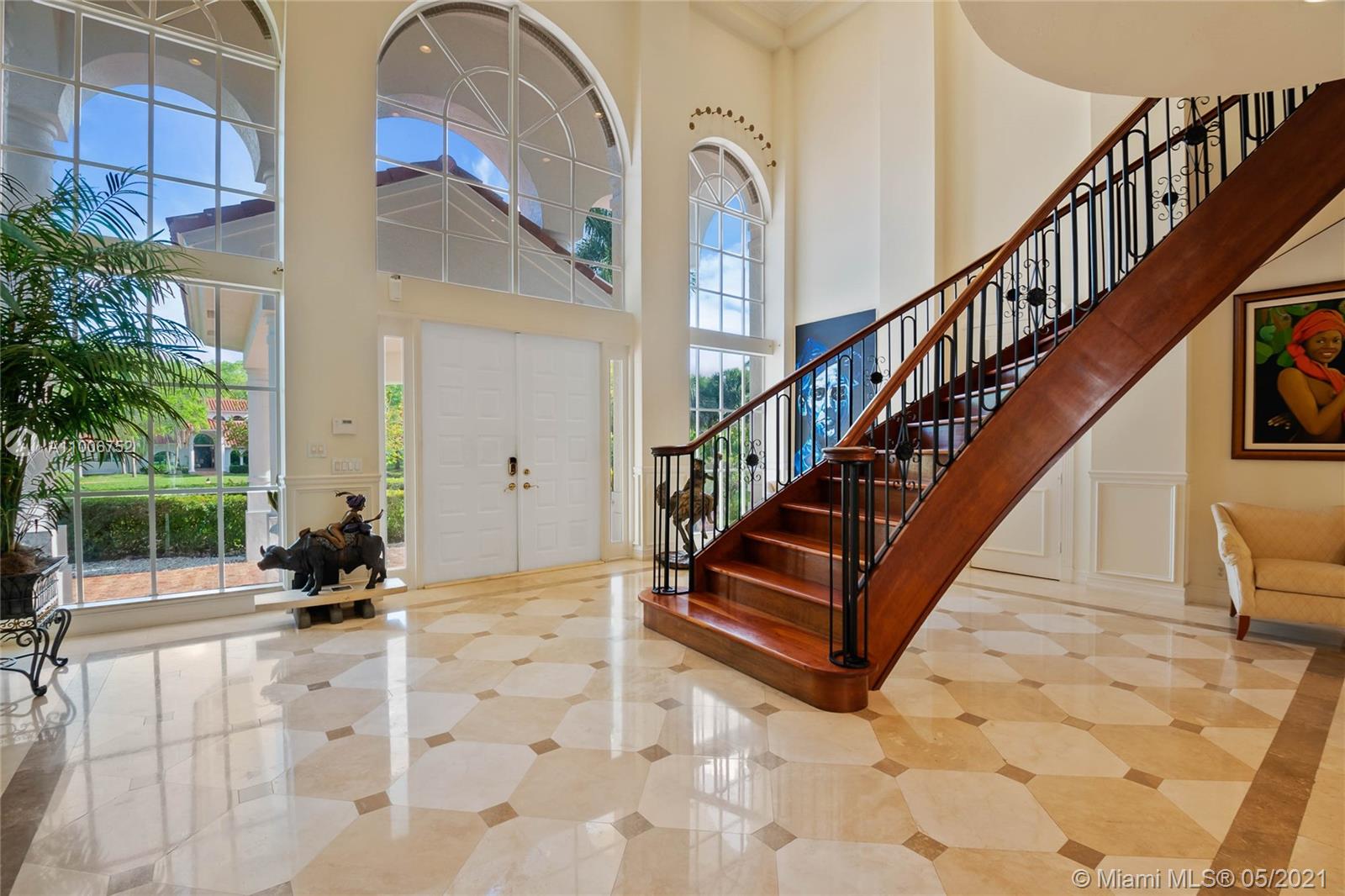 2920 Luckie Road Weston, FL 33331 - Photo 2 of 60 a living room with stairs
