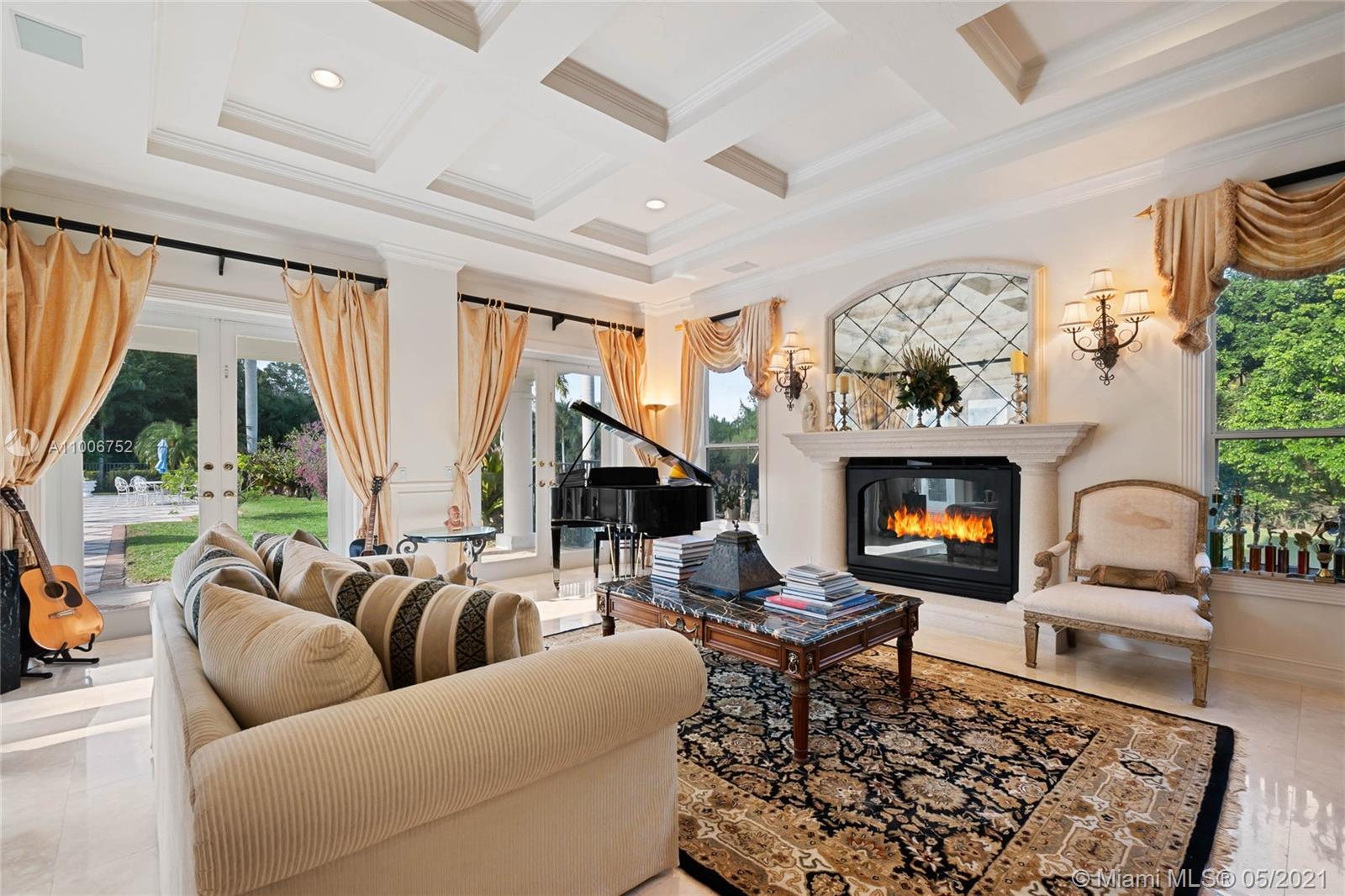 2920 Luckie Road Weston, FL 33331 - Photo 13 of 60 a living room with furniture fireplace and a large window