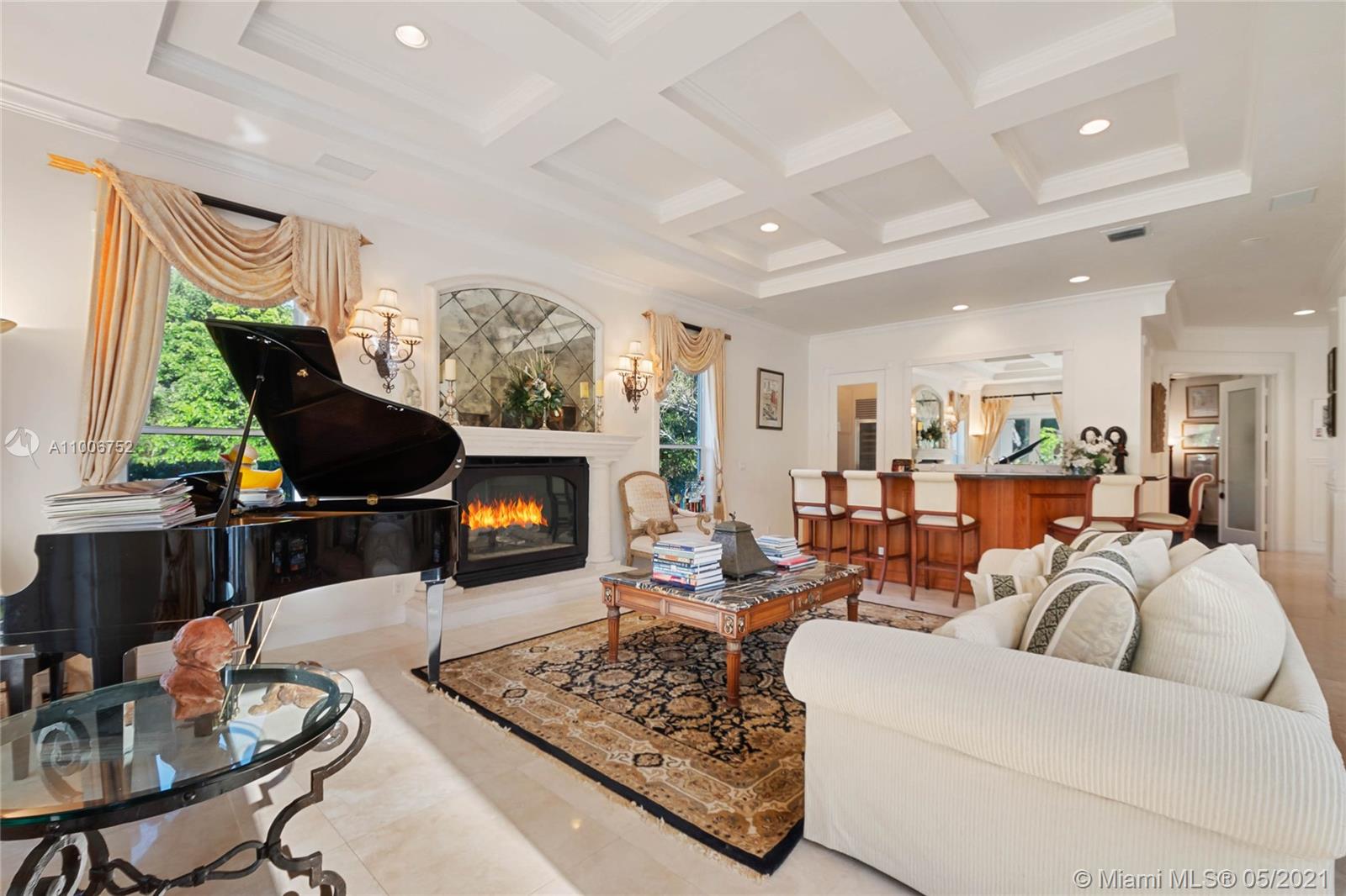 2920 Luckie Road Weston, FL 33331 - Photo 14 of 60 a living room with furniture a flat screen tv and a fireplace