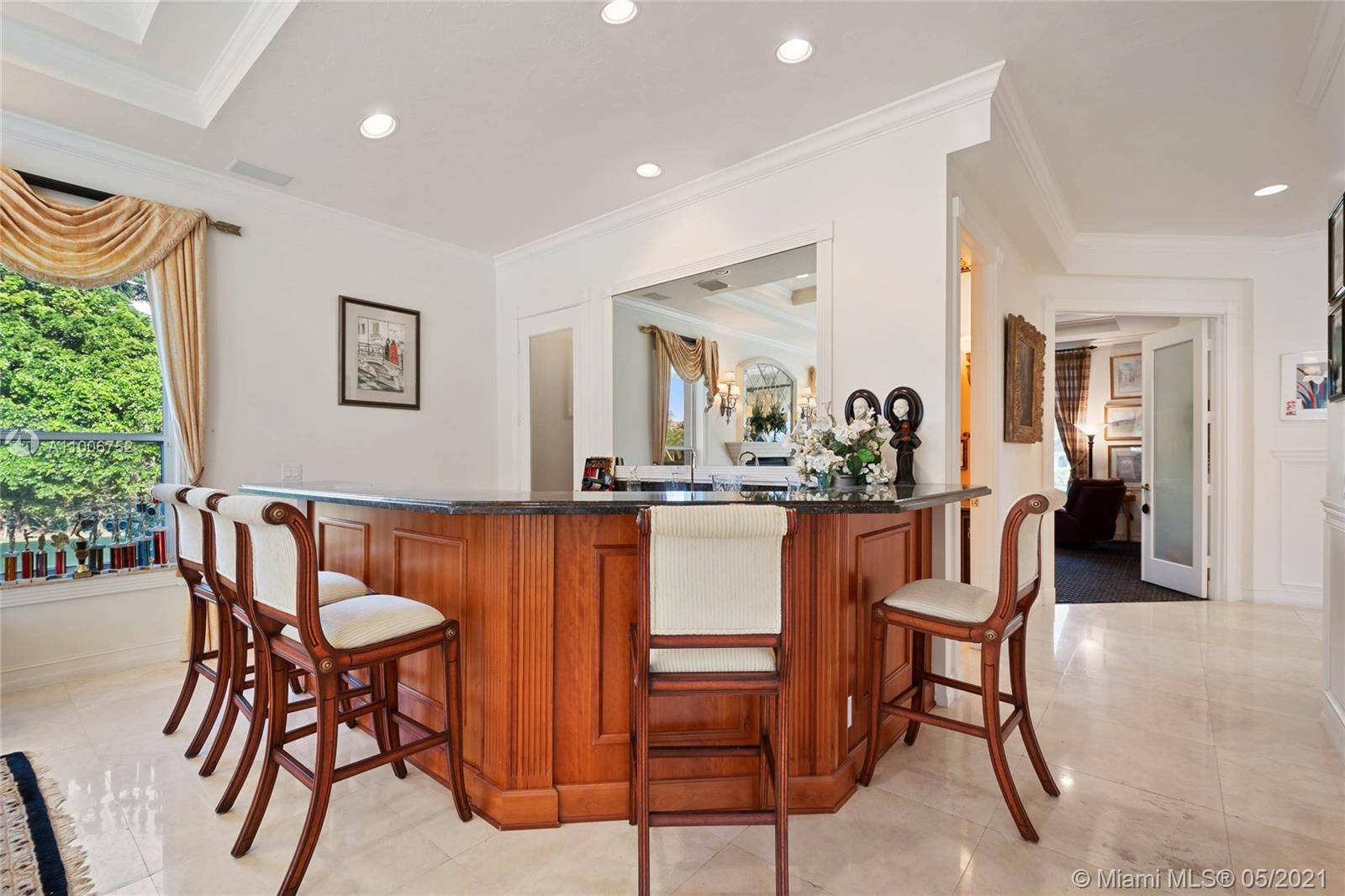 2920 Luckie Road Weston, FL 33331 - Photo 17 of 60 a dining room filled with furniture and a large window