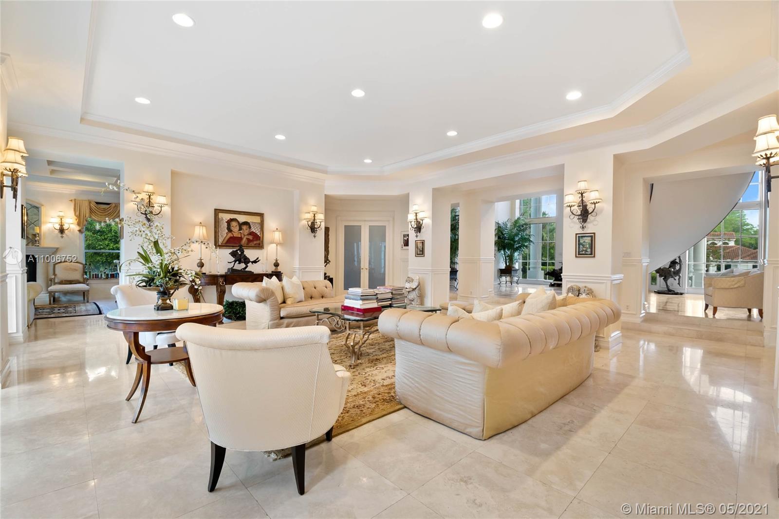 2920 Luckie Road Weston, FL 33331 - Photo 3 of 60 a living room with fireplace furniture and a large window