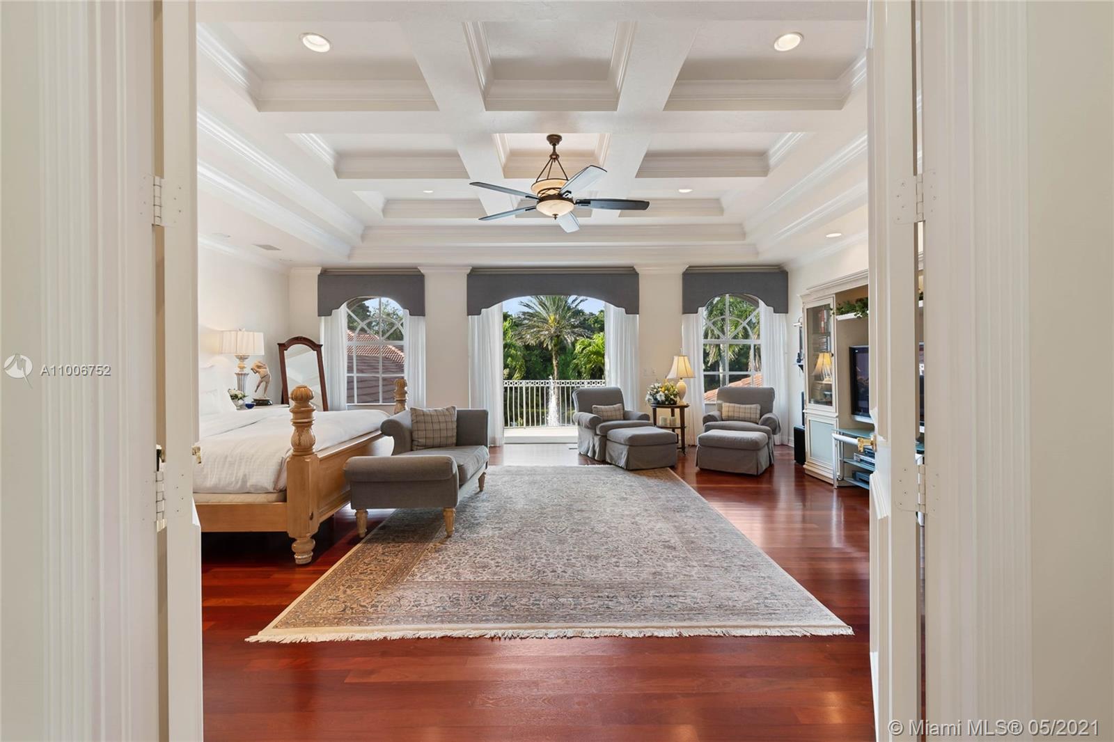 2920 Luckie Road Weston, FL 33331 - Photo 21 of 60 a living room with furniture and a chandelier