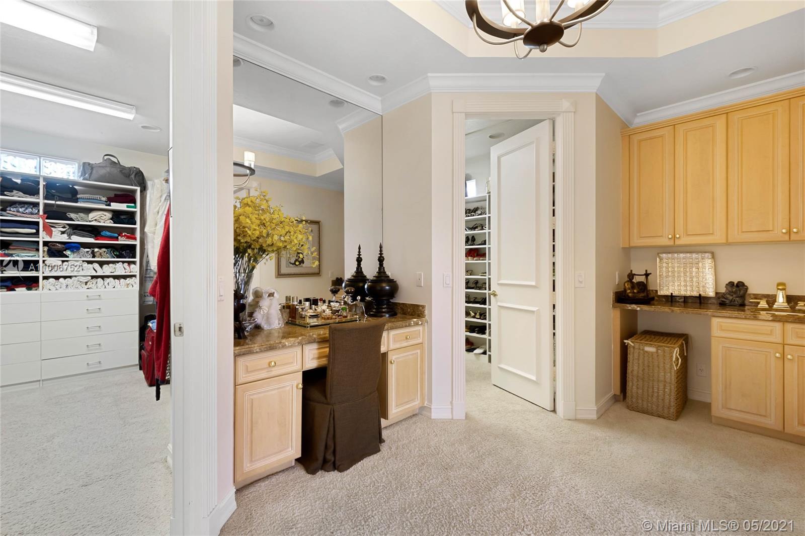 2920 Luckie Road Weston, FL 33331 - Photo 25 of 60 a kitchen with cabinets and a stove