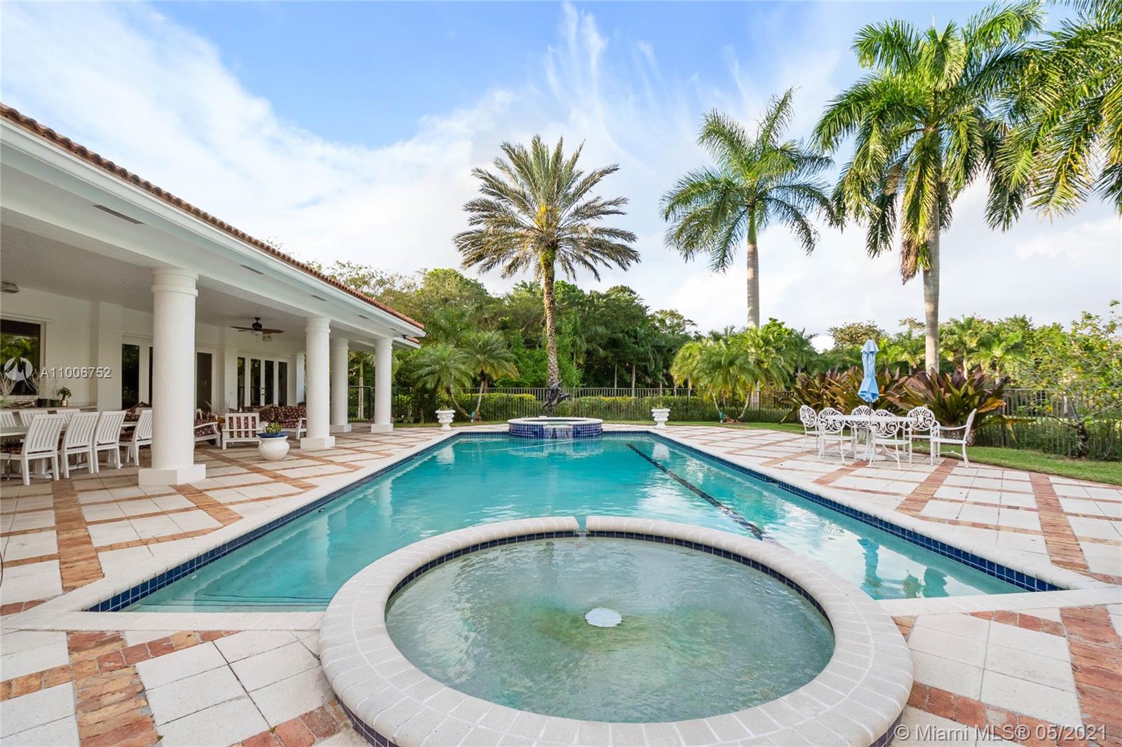 2920 Luckie Road Weston, FL 33331 - Photo 36 of 60 a view of a swimming pool with a lounge chair