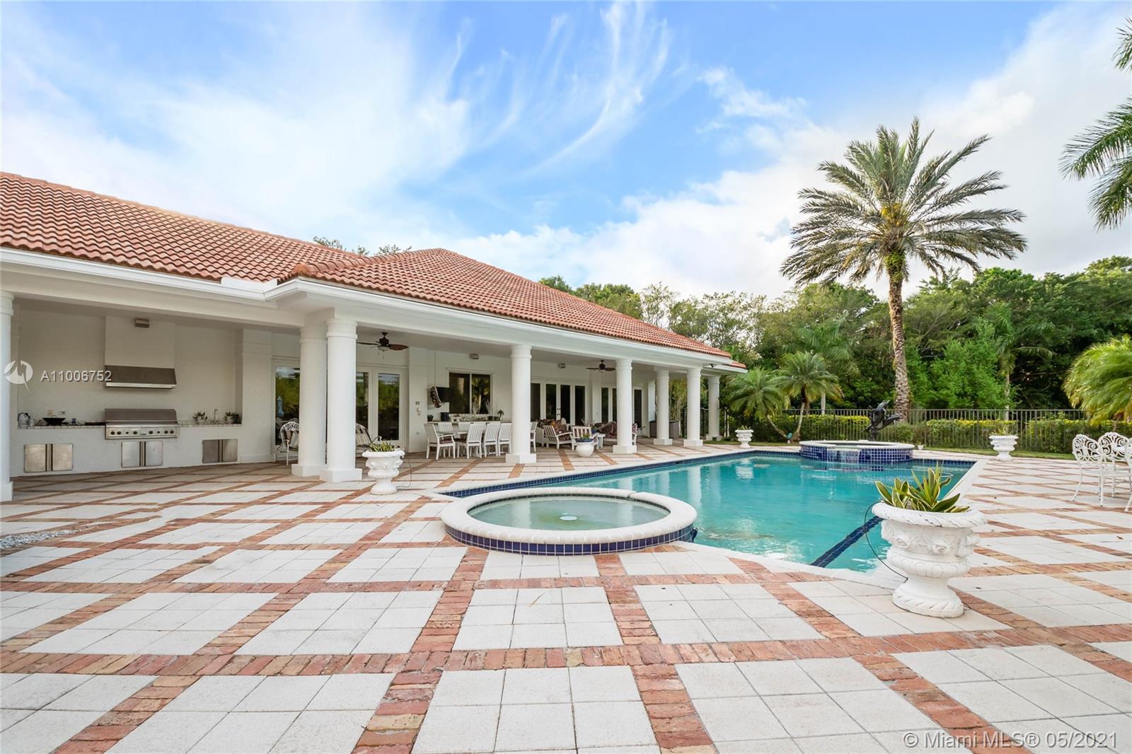 2920 Luckie Road Weston, FL 33331 - Photo 37 of 60 a front view of a house with swimming pool having outdoor seating