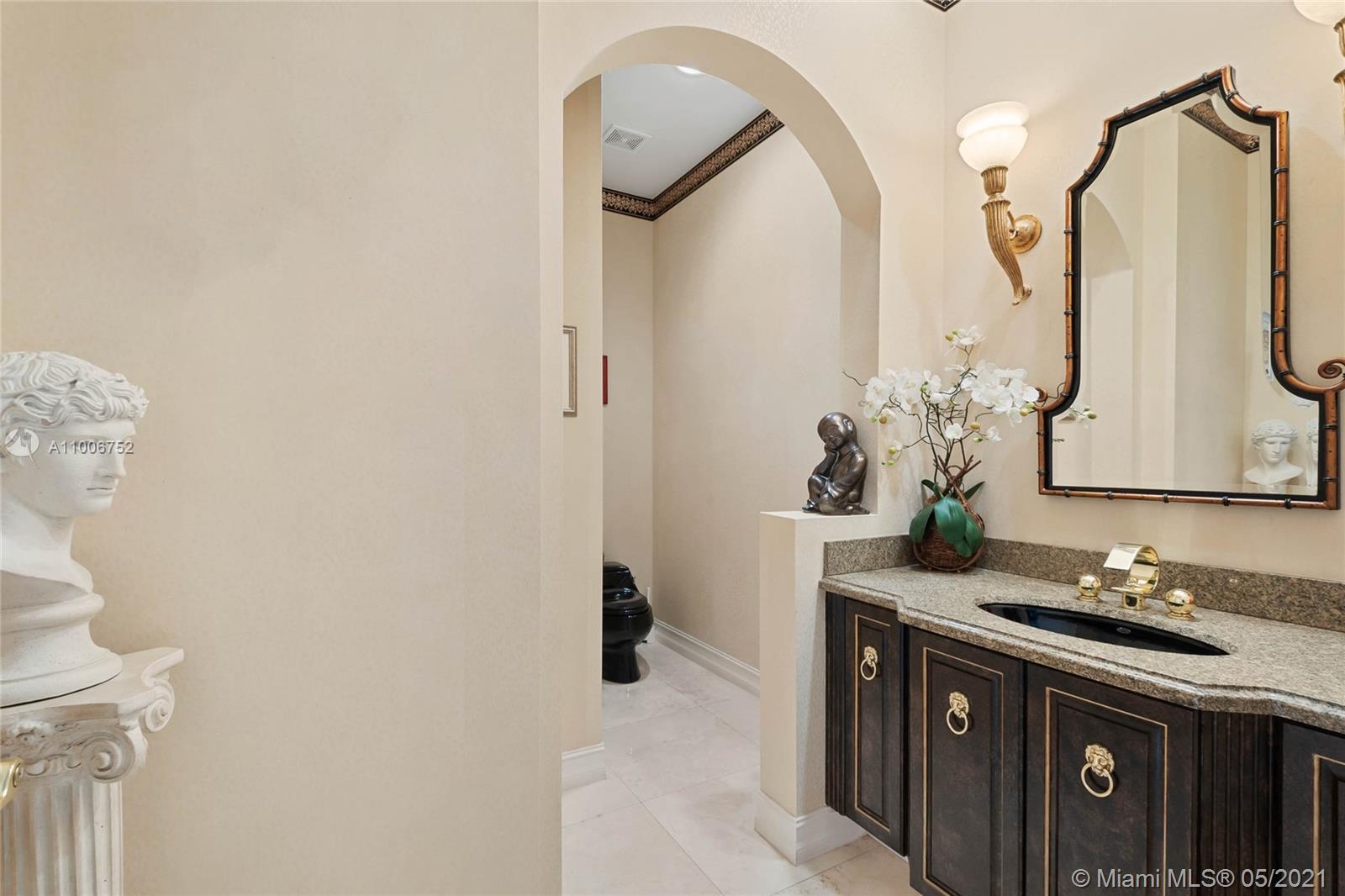 2920 Luckie Road Weston, FL 33331 - Photo 41 of 60 a bathroom with a granite countertop sink a mirror and a shower