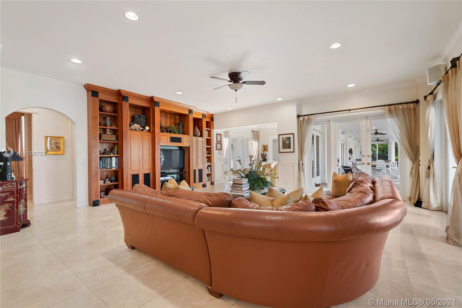 2920 Luckie Road Weston, FL 33331 - Photo 42 of 60 a living room with furniture and a ceiling fan