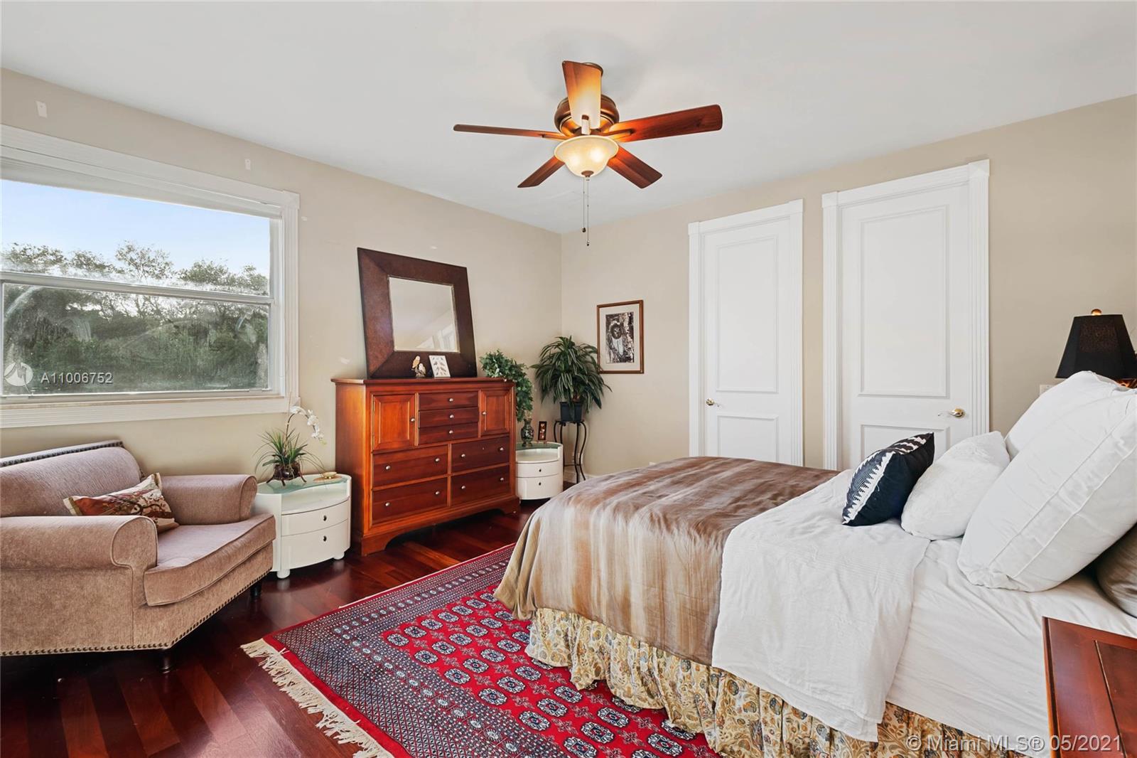 2920 Luckie Road Weston, FL 33331 - Photo 47 of 60 a bedroom with a bed couch and a window