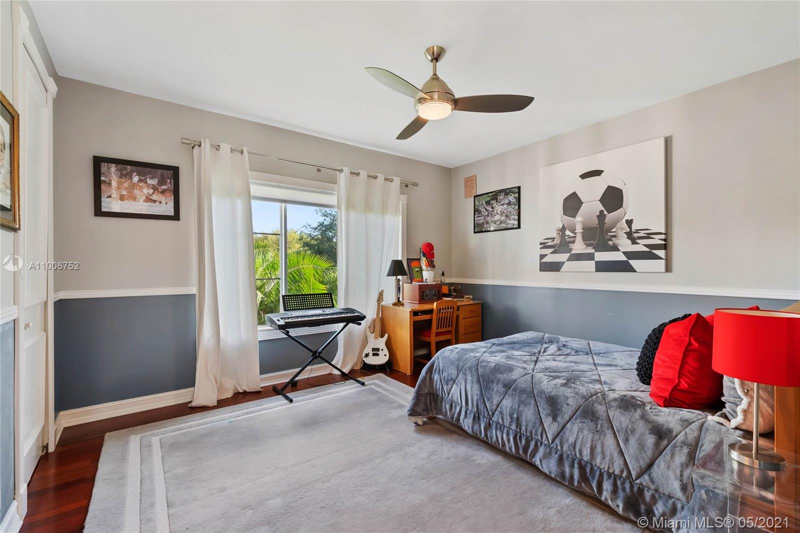 2920 Luckie Road Weston, FL 33331 - Photo 48 of 60 a bedroom with a bed and window