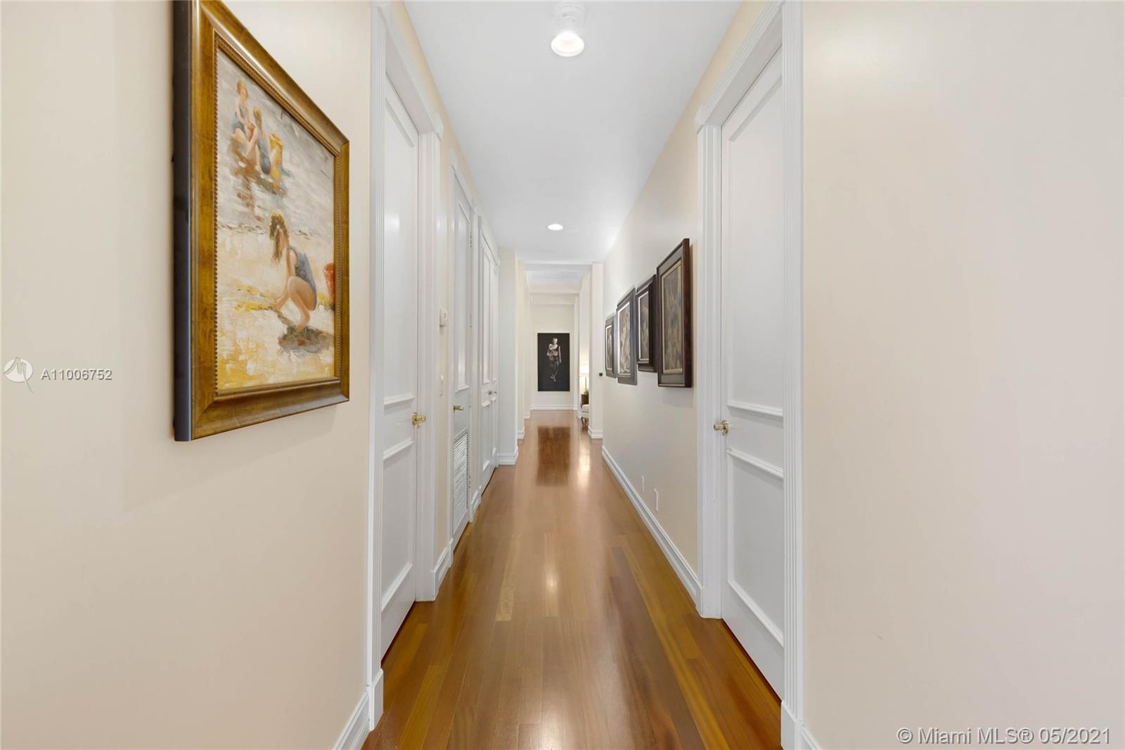 2920 Luckie Road Weston, FL 33331 - Photo 49 of 60 a view of a hallway with wooden floor and staircase