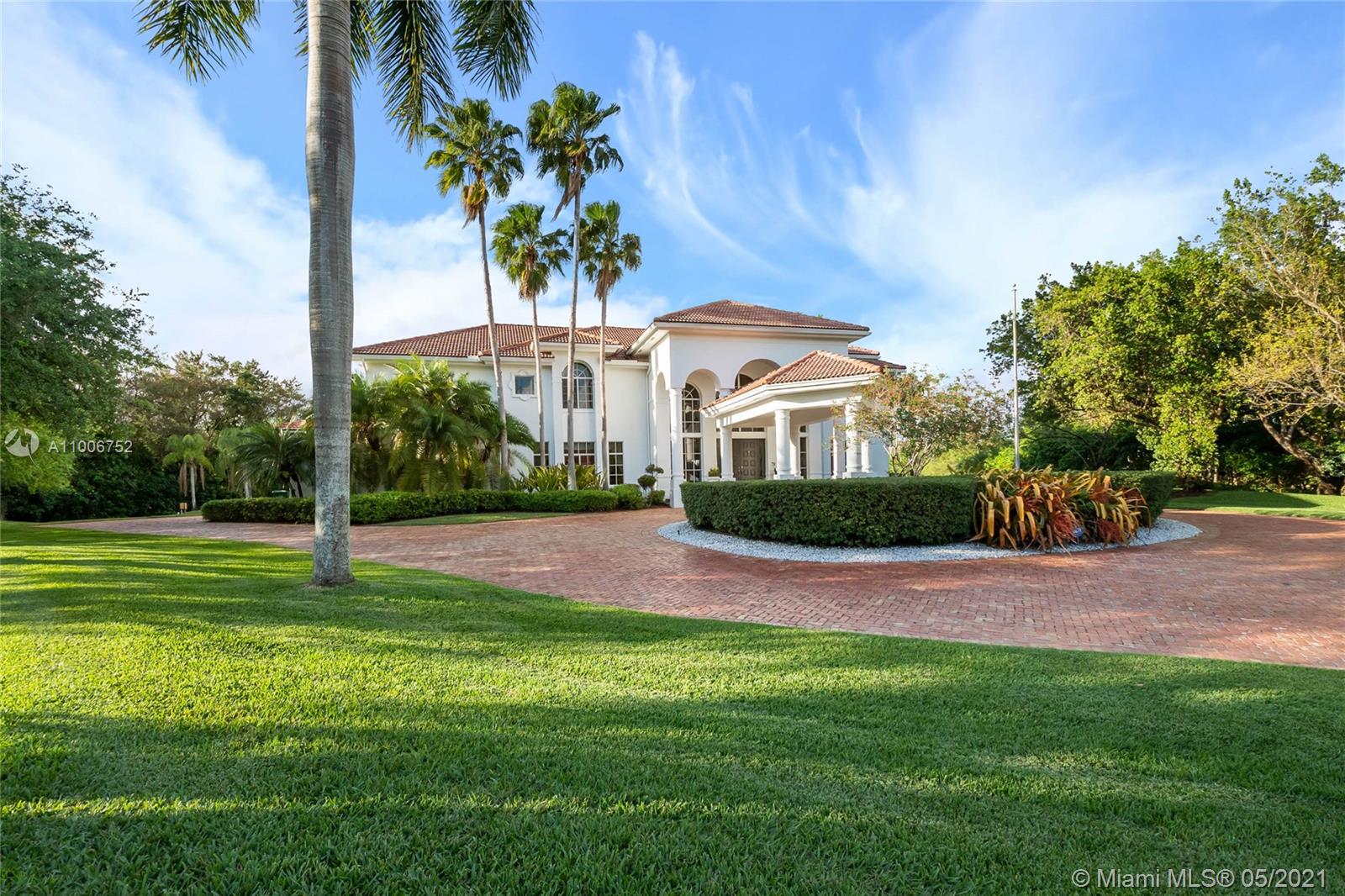 2920 Luckie Road Weston, FL 33331 - Photo 55 of 60 a front view of a house with garden