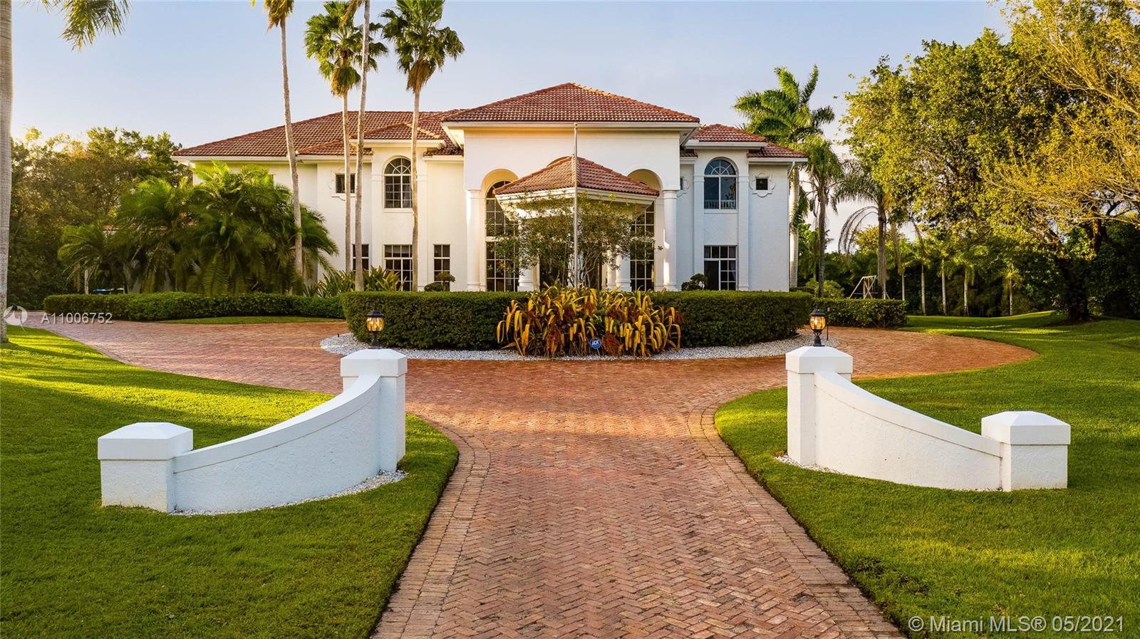 2920 Luckie Road Weston, FL 33331 - Photo 60 of 60 a view of a house with swimming pool and a yard