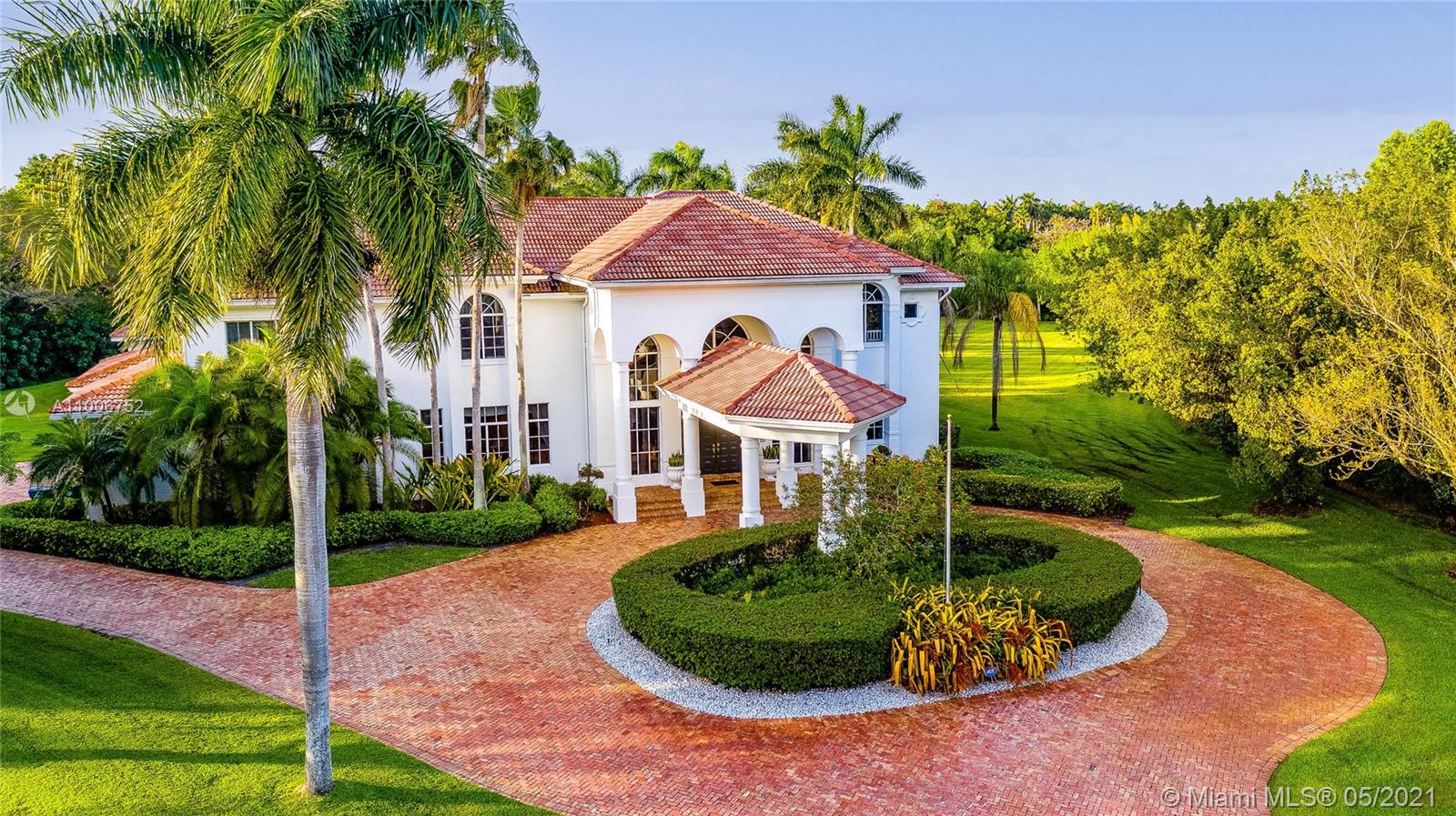 2920 Luckie Road Weston, FL 33331 - Photo 8 of 60 a front view of a house with a yard