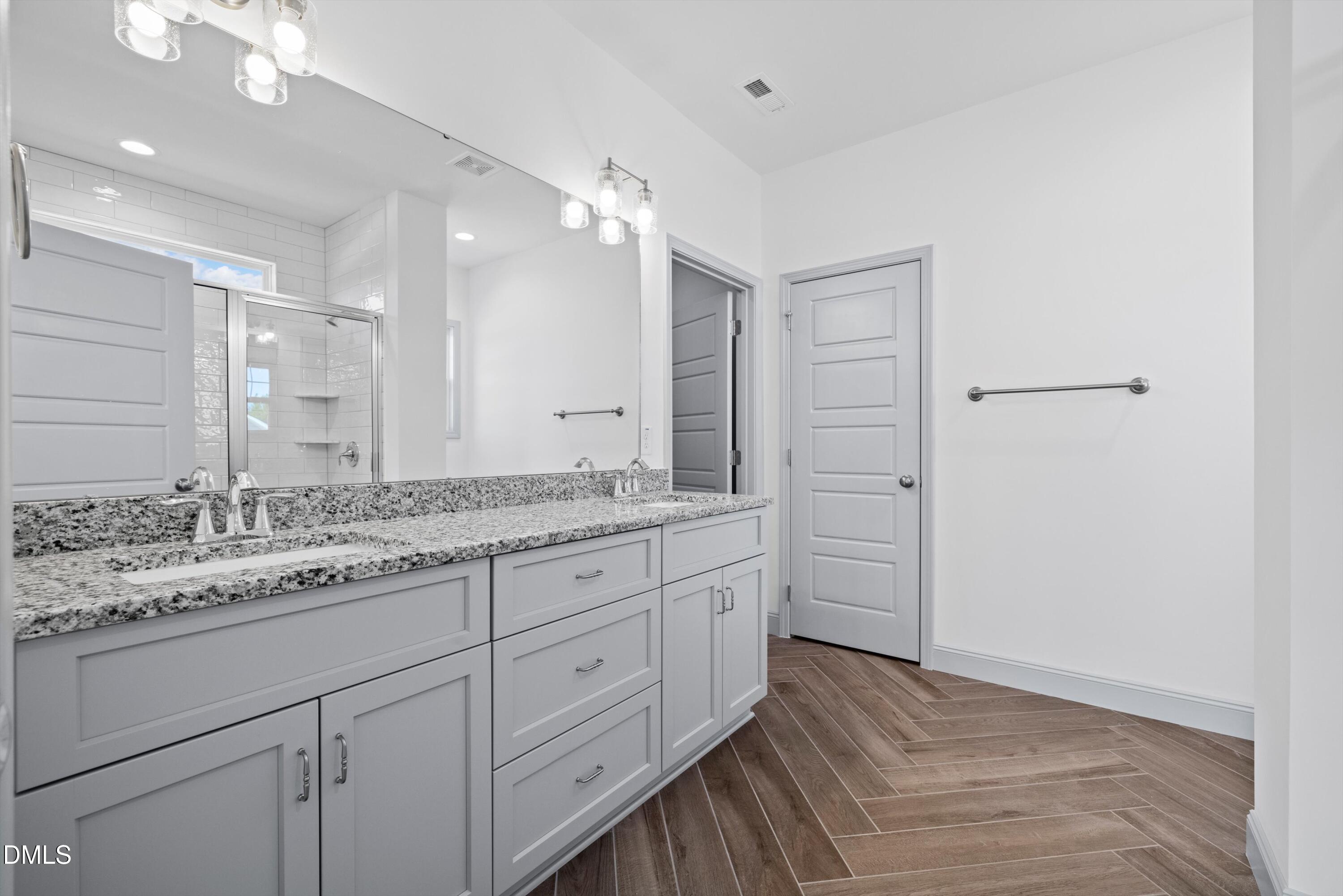 73 Falls Riv Court Broadway, NC 27505 - Photo 17 of 39 a bathroom with a granite countertop sink mirror and double