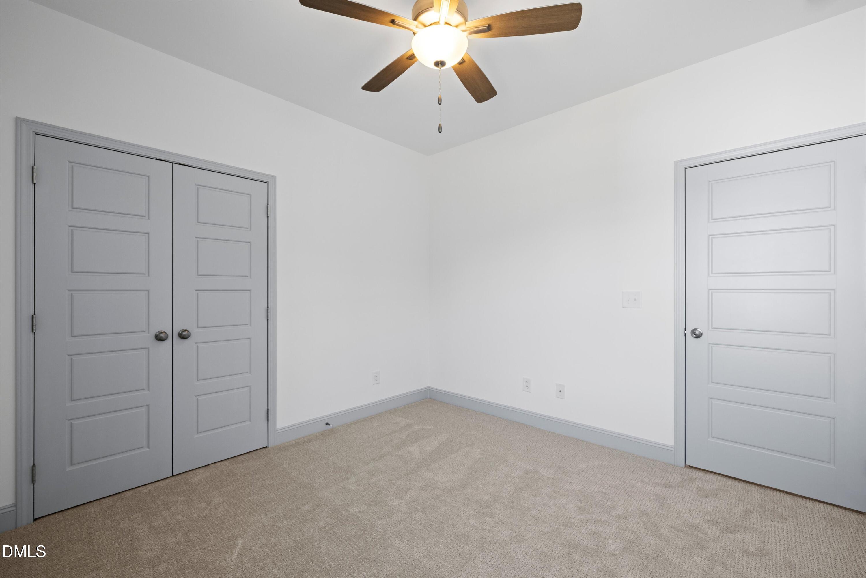 73 Falls Riv Court Broadway, NC 27505 - Photo 33 of 39 an empty room with closet and fan