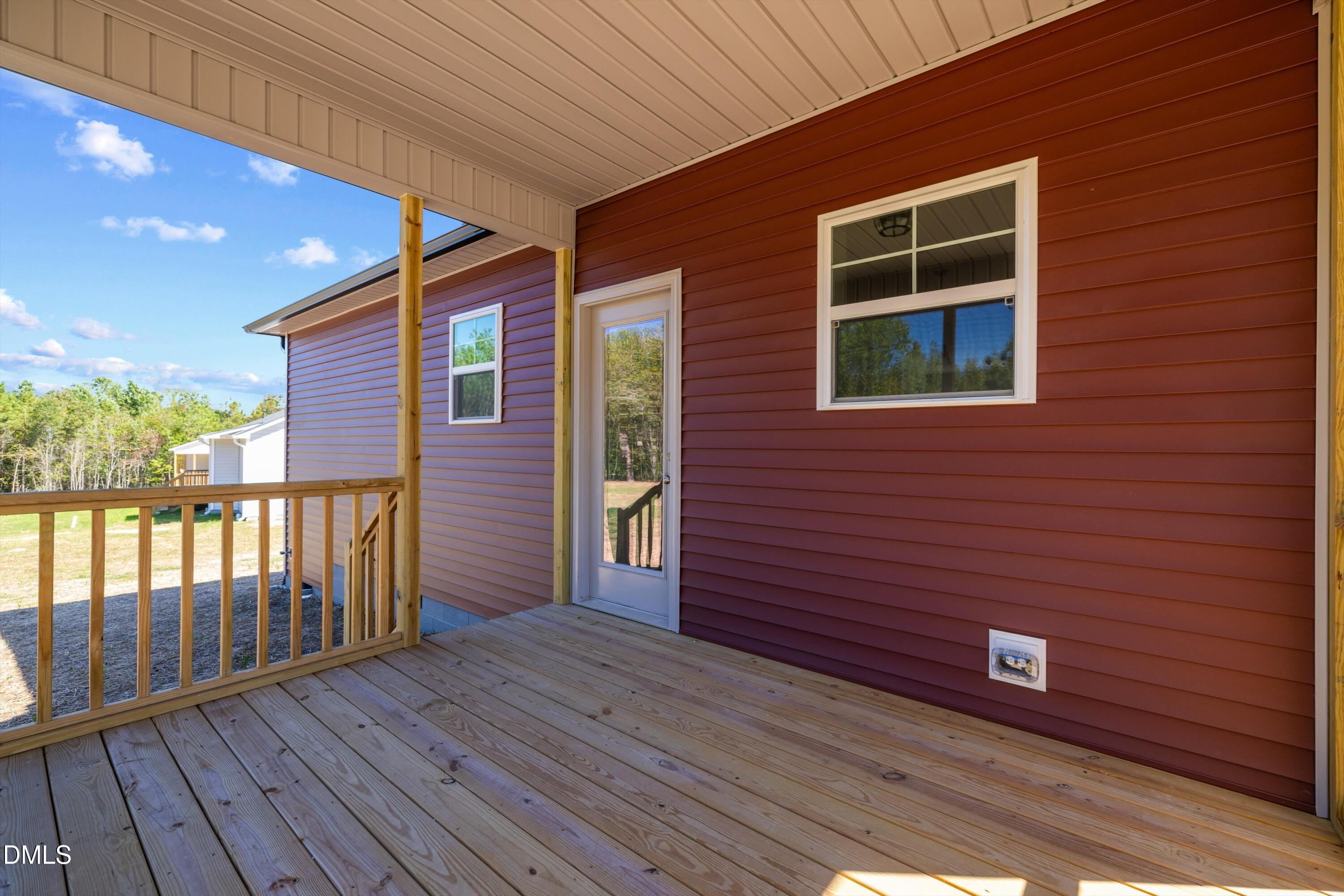 73 Falls Riv Court Broadway, NC 27505 - Photo 36 of 39 a view of a brick house with a wooden deck