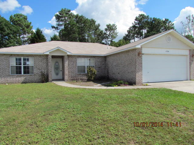 1226 Northview Drive Crestview, FL 32536 - Photo 1 of 13 a front view of a house with garden
