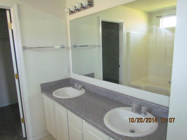 1226 Northview Drive Crestview, FL 32536 - Photo 11 of 13 a bathroom with a granite countertop sink and a mirror