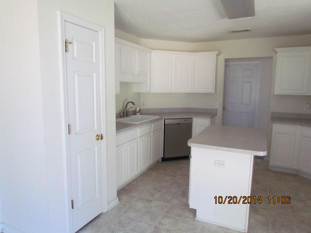 1226 Northview Drive Crestview, FL 32536 - Photo 6 of 13 a kitchen with a sink a stove and cabinets