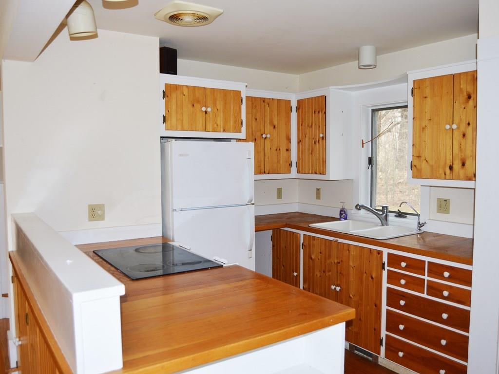 276 Turkey Farm Road Blue Hill, ME 04614 - Photo 12 of 30 Galley-style kitchen with glass...