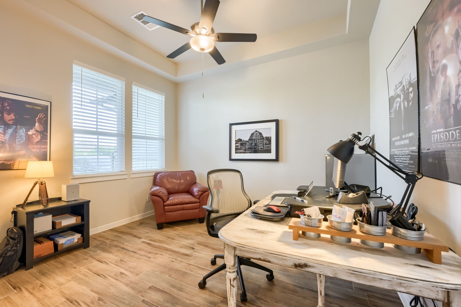 621 Rancho Sienna Loop Georgetown, TX 78628 - Photo 5 of 28 Well-lit room for work or relaxation featuring a ceiling fan and elegant flooring.