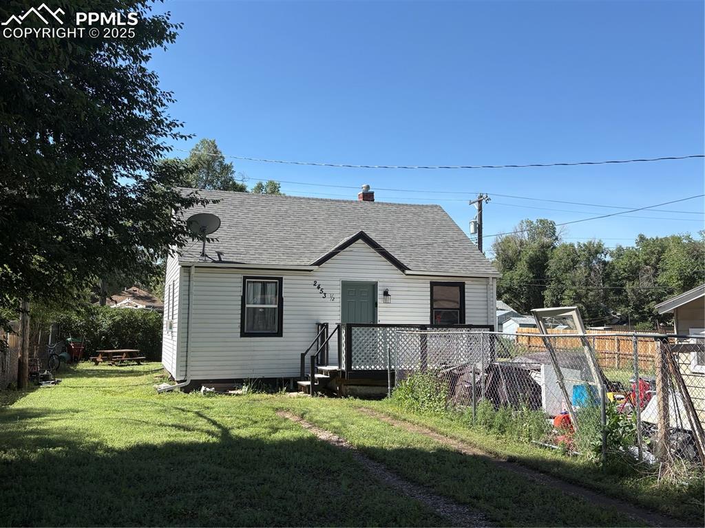 2453 East Willamette Avenue, Unit 1/2 Colorado Springs, CO 80909 - Photo 1 of 16 a view of a house with backyard