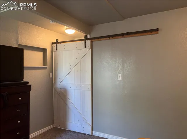 a bathroom with a shower and a mirror