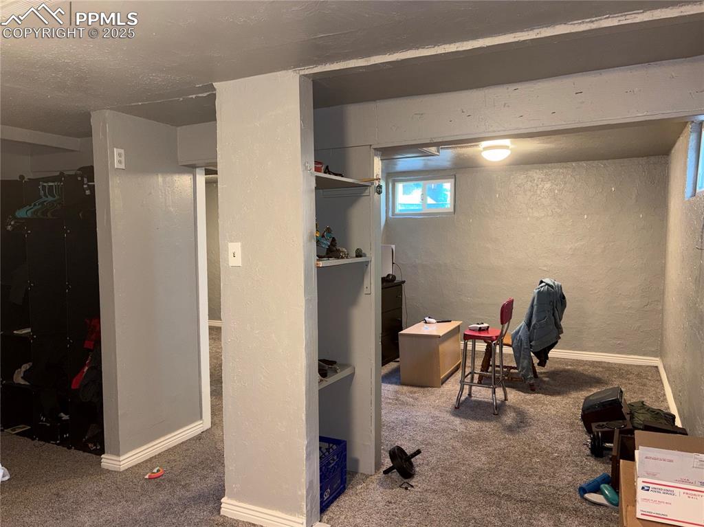 2453 East Willamette Avenue, Unit 1/2 Colorado Springs, CO 80909 - Photo 16 of 16 a view of a workspace with furniture and a window