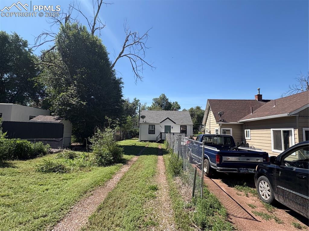 2453 East Willamette Avenue, Unit 1/2 Colorado Springs, CO 80909 - Photo 2 of 16 a view of a house with backyard and sitting area