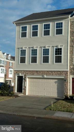 a front view of a house with yard