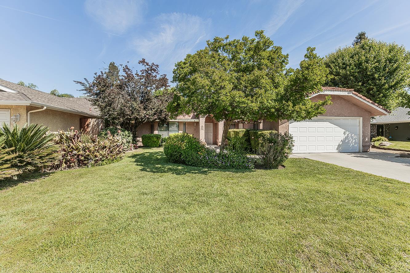 1908 East Niles Avenue Fresno, CA 93720 - Photo 1 of 30 a front view of a house with a yard and garage