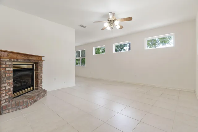 a view of a hallway with toilet and entryway