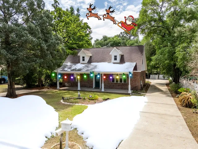 a view of a house with swimming pool and sitting area